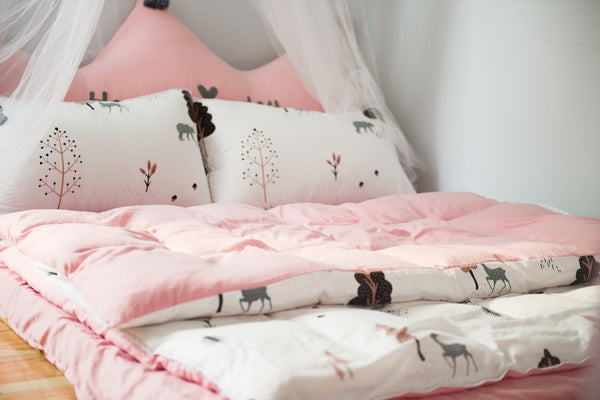 Soft bedding and drapes to create a cosy space for children
