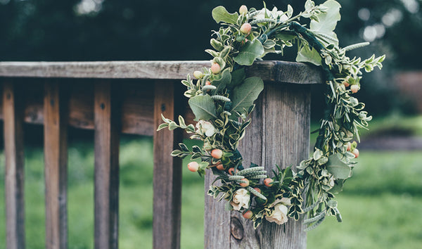 Floral hair wreath on wooden fence 