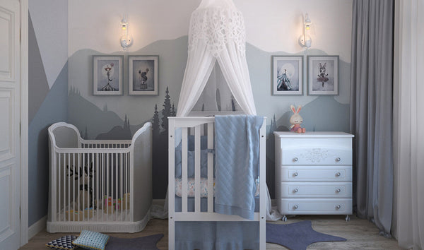 A children's bedroom with blue and white coloured painted mountains on the walls for fun kids bedroom decor ideas  