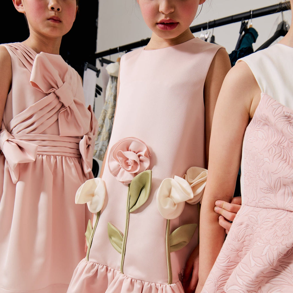 Jessie And James Girls Satin Kiss Me Over The Garden Fence Dress in Pink